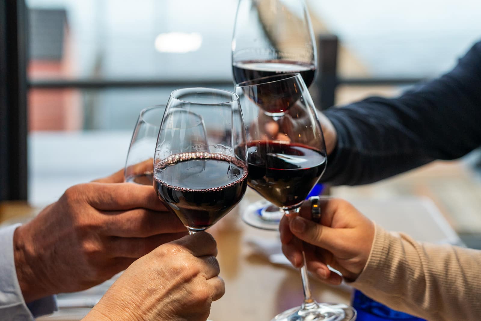 People toasting with glasses of wine