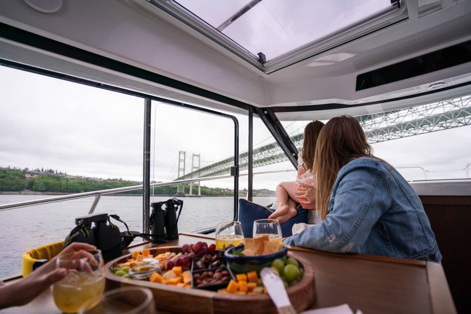 People enjoying food on a boat in Gig Harbor